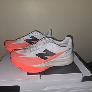 White and Pink Athletic Shoes